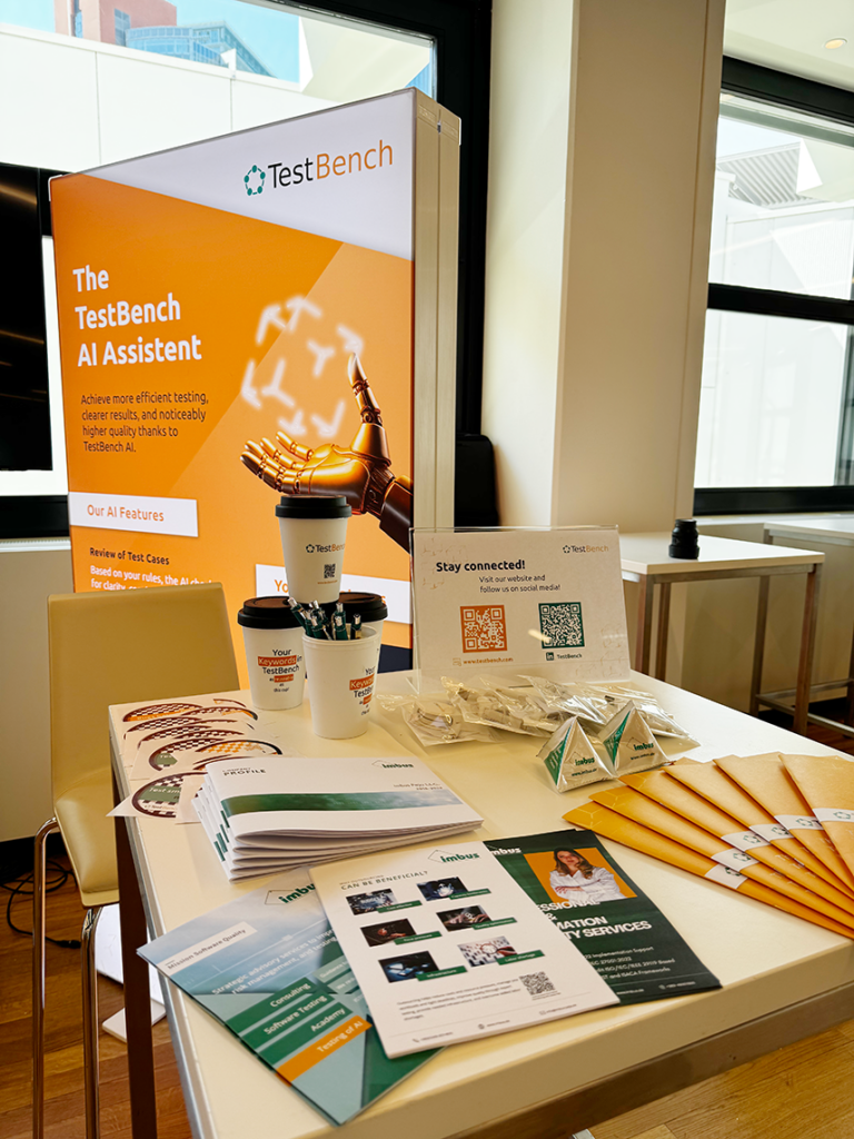 Trade show booth with promotional materials including a display about AI features, two coffee cups, a QR code sign, and giveaways on a table.